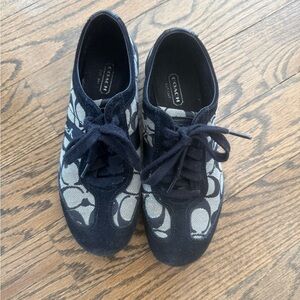 Woman’s Black Coach Monogram Sneakers